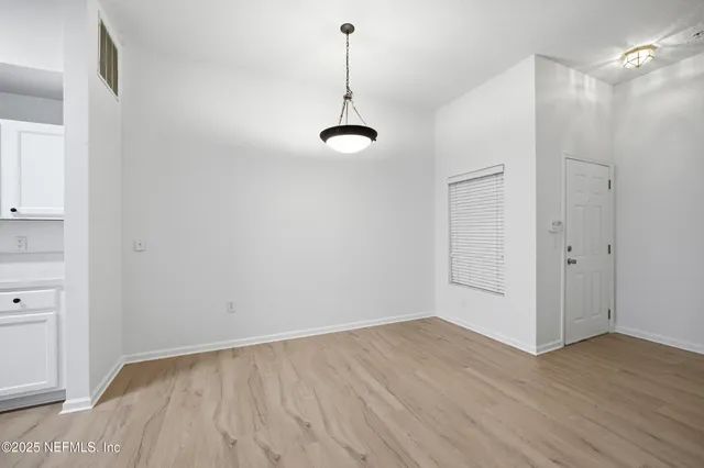 a bathroom with a granite countertop sink toilet a mirror and bathtub