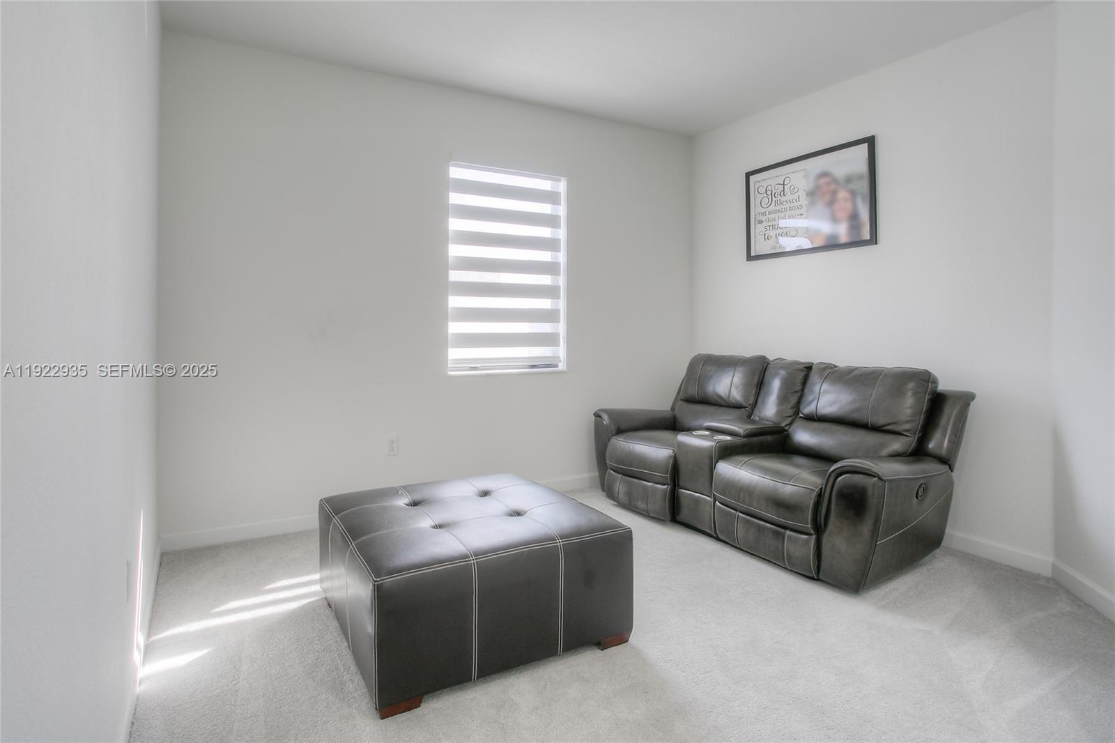 12911 Southwest 231st Terrace Miami, FL 33170 - Photo 11 of 15 a living room with furniture and a window