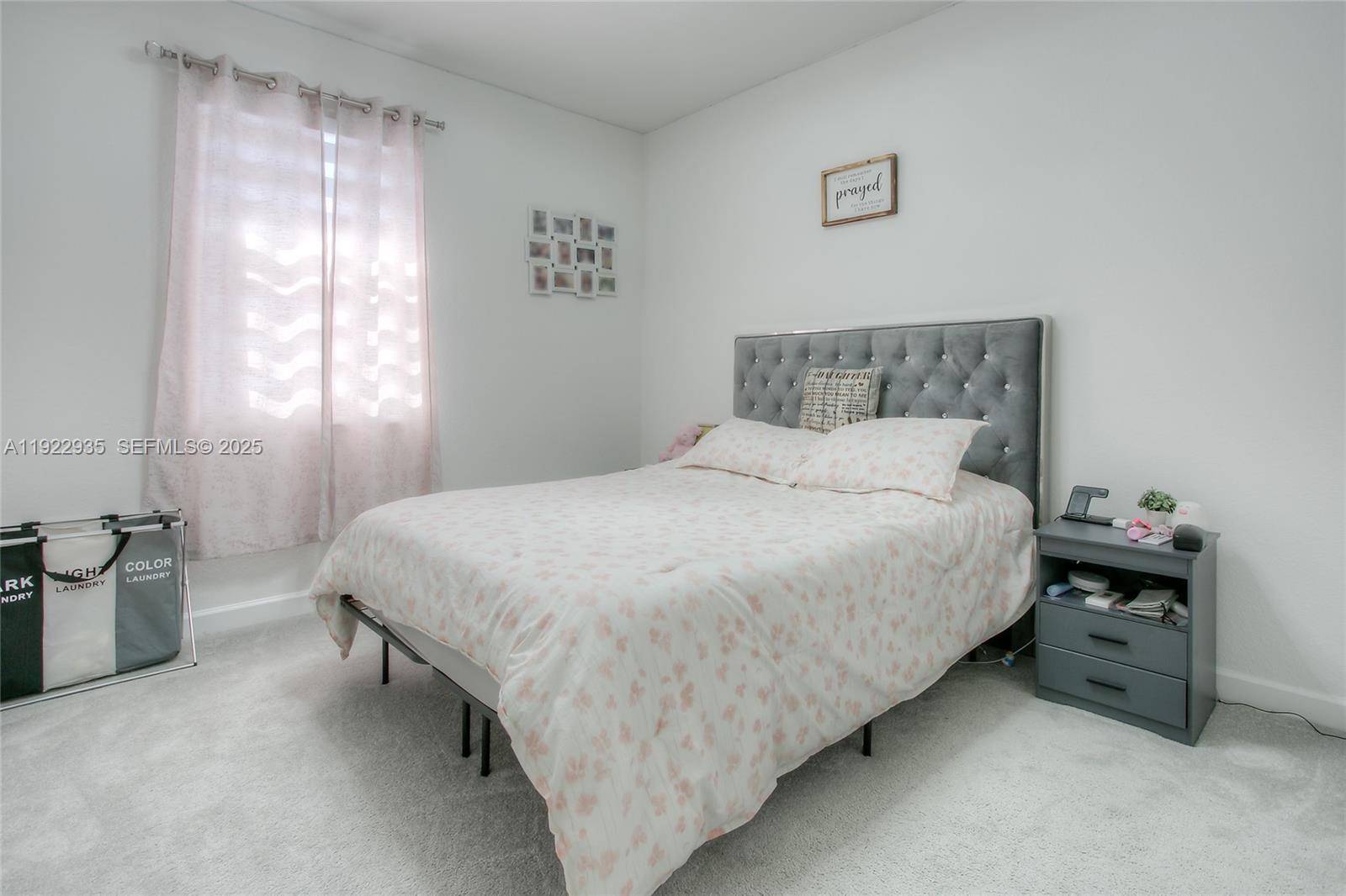 12911 Southwest 231st Terrace Miami, FL 33170 - Photo 15 of 15 a bedroom with a bed and a couch