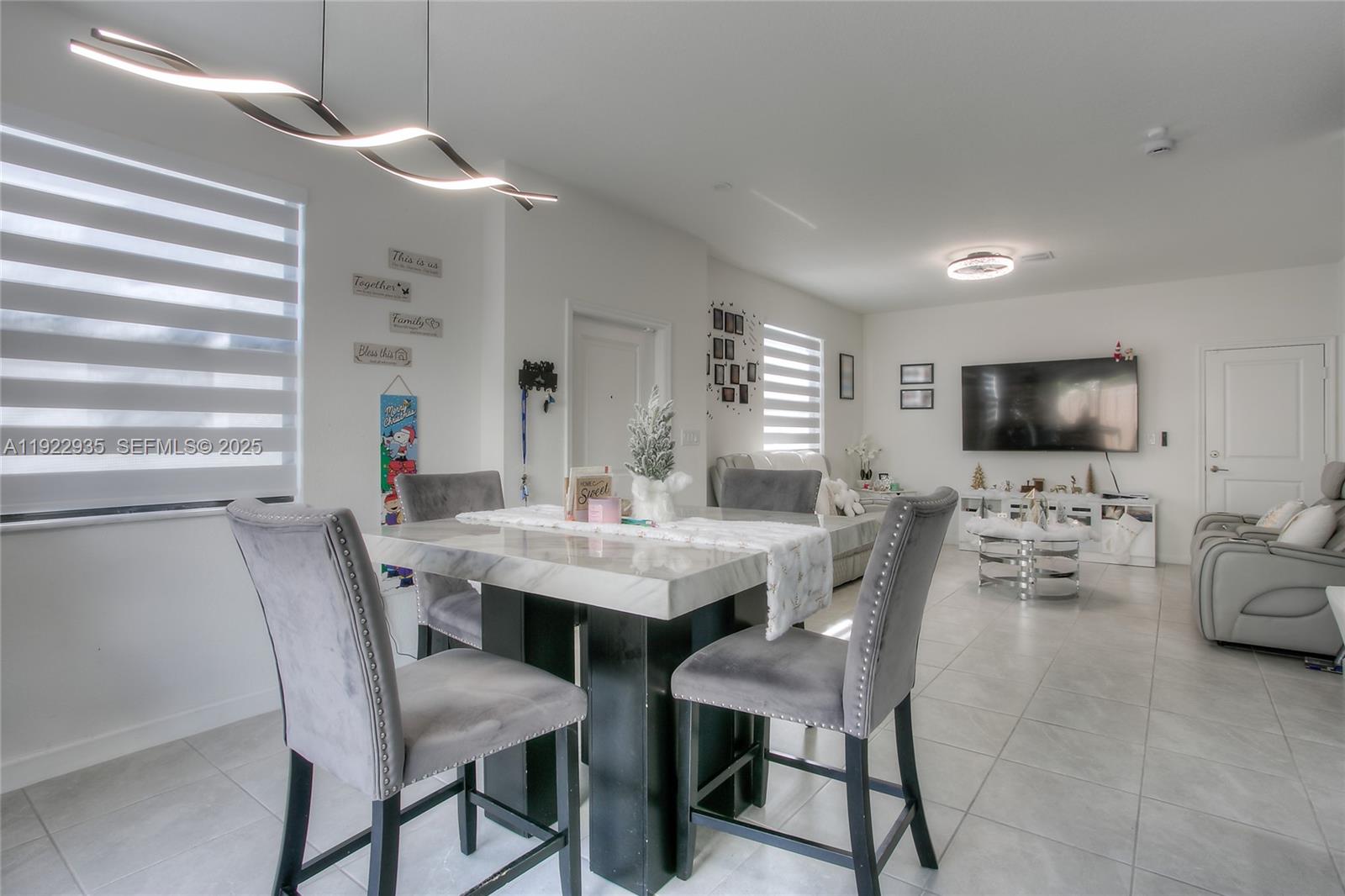 12911 Southwest 231st Terrace Miami, FL 33170 - Photo 6 of 15 a view of a dining room with furniture