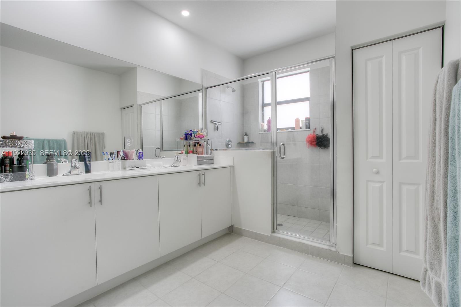 12911 Southwest 231st Terrace Miami, FL 33170 - Photo 7 of 15 a bathroom with a sink mirror and a shower