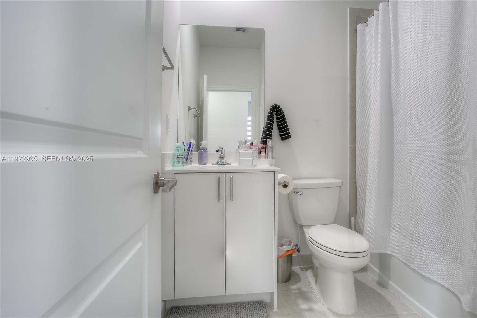 12911 Southwest 231st Terrace Miami, FL 33170 - Photo 8 of 15 a white toilet sitting next to a bathroom sink