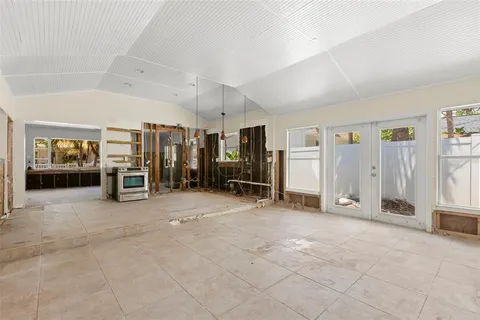 a view of an empty room with a ceiling fan