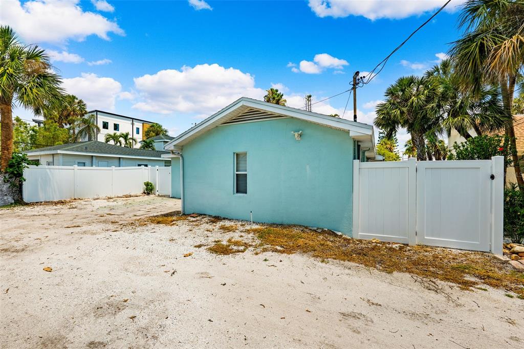 106 13th Avenue St. Pete Beach, FL 33706 - Photo 30 of 41 a view of a house with a snow in the background