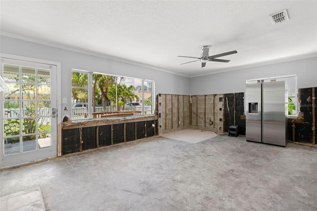 106 13th Avenue St. Pete Beach, FL 33706 - Photo 5 of 41 a large white bed with a large window