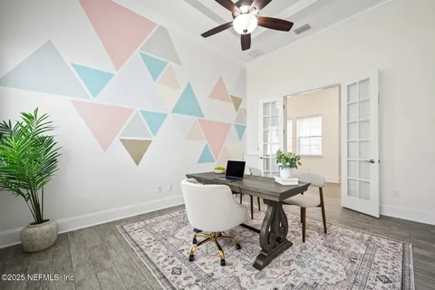 a living room with furniture a chandelier and a dining room