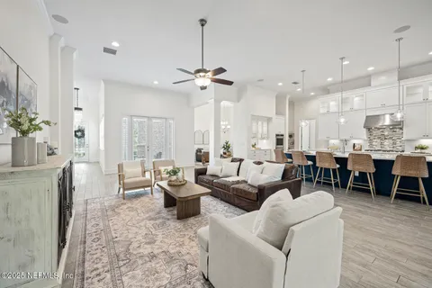 a large kitchen with a table and chairs