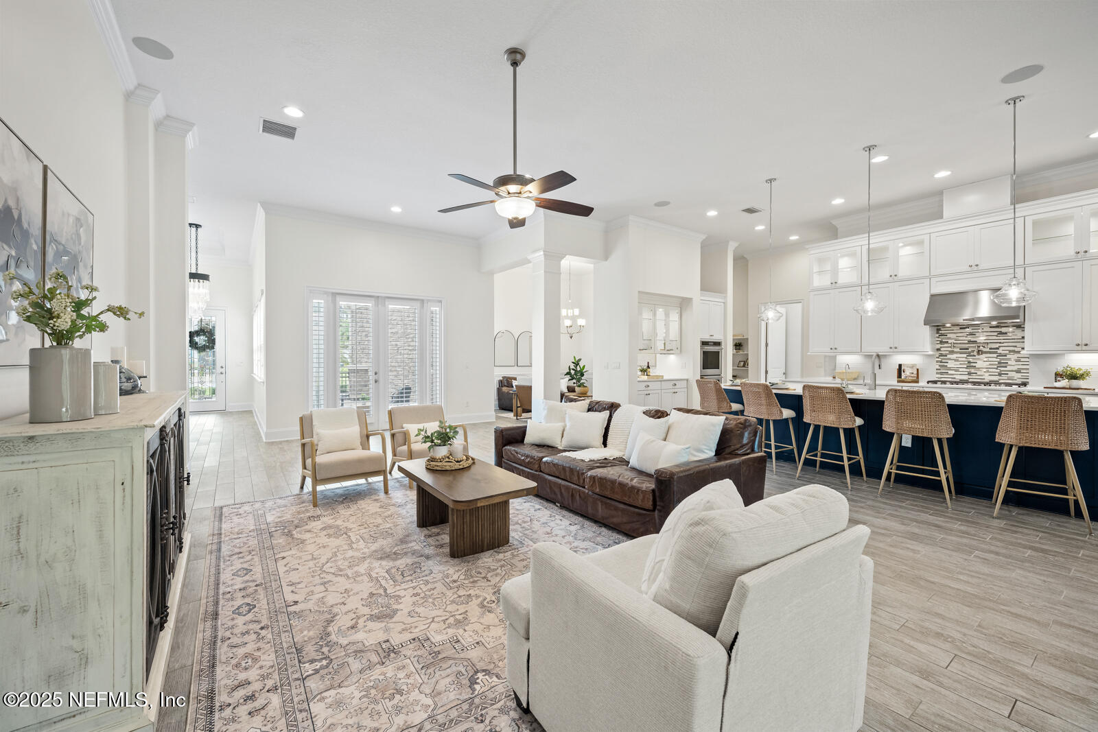 190 Deer Valley Drive Ponte Vedra, FL 32081 - Photo 14 of 95 a living room with lots of furniture and a chandelier