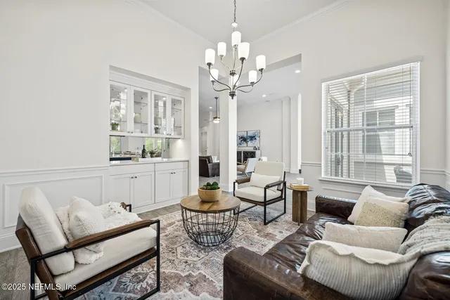 a spacious bedroom with a balcony a bed and a large window with wooden floor