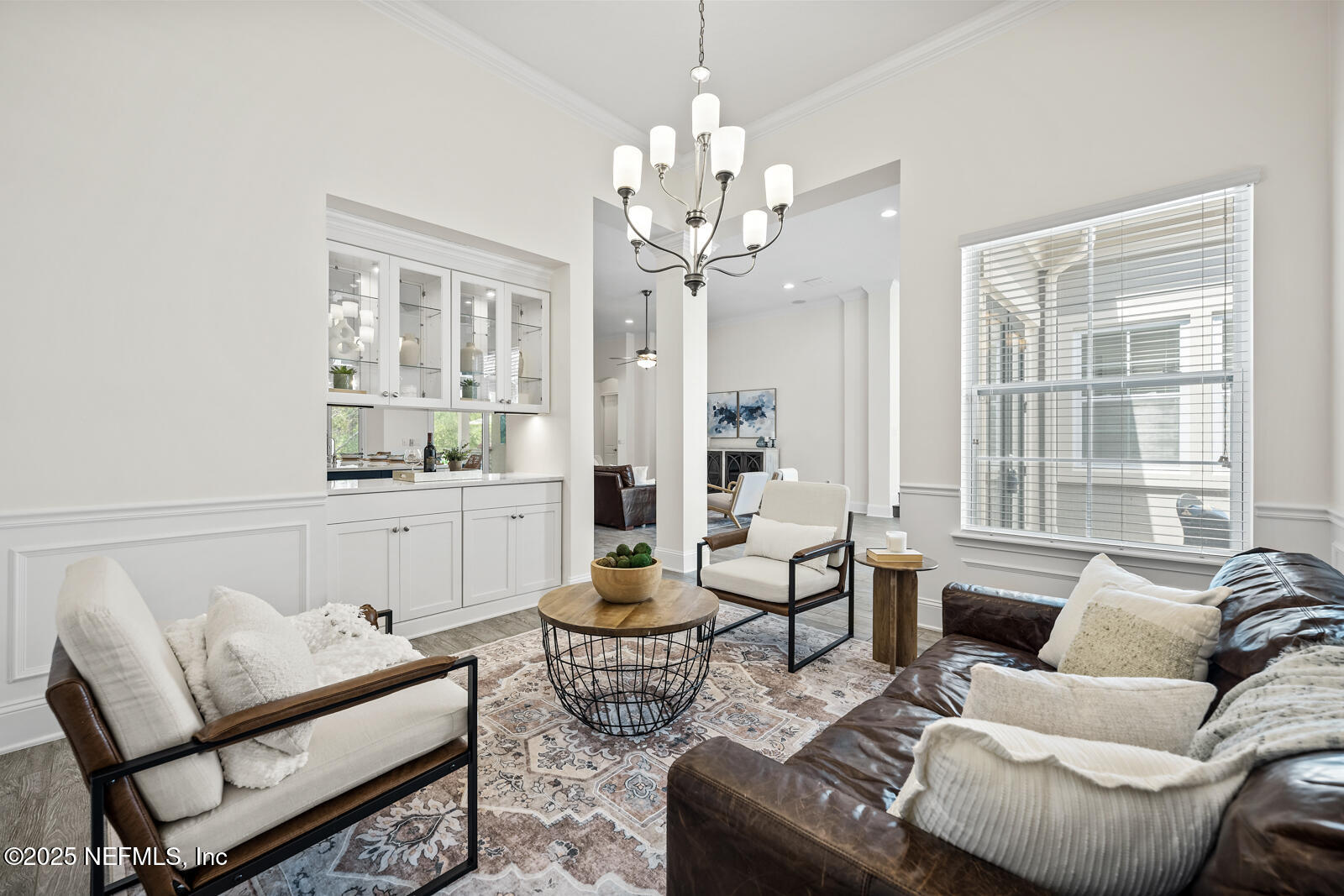 190 Deer Valley Drive Ponte Vedra, FL 32081 - Photo 19 of 95 a living room with furniture a chandelier and a window