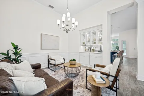 a bathroom with a granite countertop sink a bathtub a mirror and shower