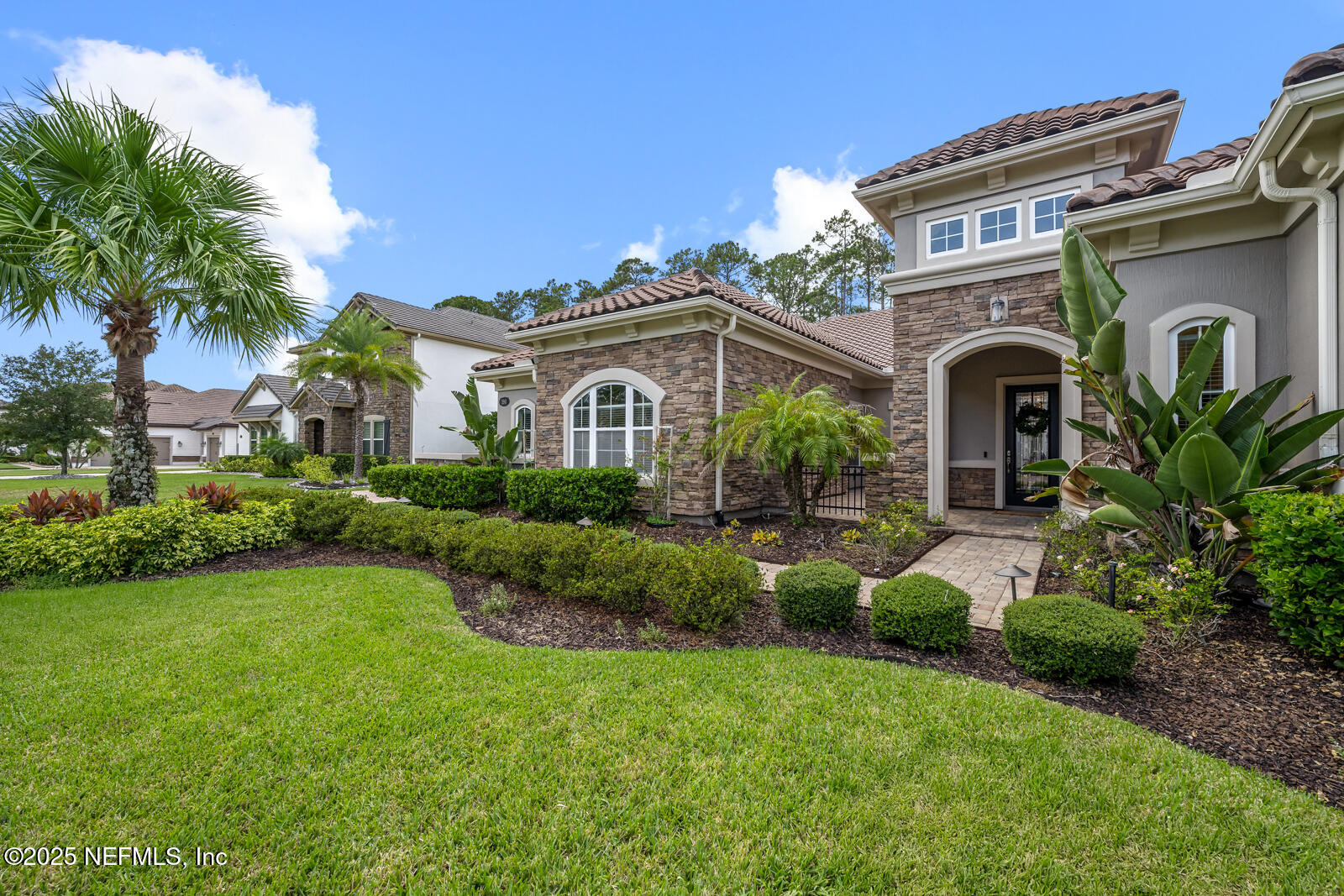 190 Deer Valley Drive Ponte Vedra, FL 32081 - Photo 2 of 95 a front view of a house with a garden