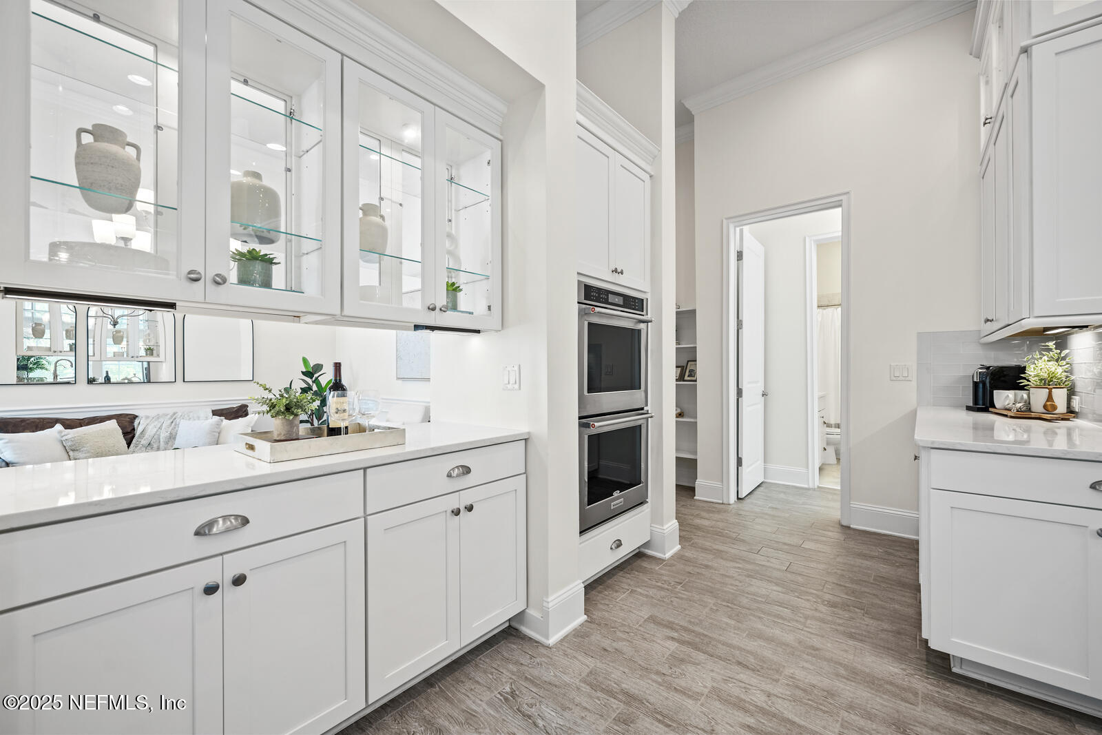 190 Deer Valley Drive Ponte Vedra, FL 32081 - Photo 22 of 95 a kitchen with white cabinets and stainless steel appliances