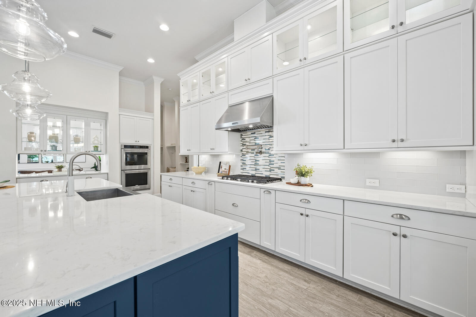 190 Deer Valley Drive Ponte Vedra, FL 32081 - Photo 25 of 95 a kitchen with stainless steel appliances kitchen island granite countertop a sink a stove and white cabinets