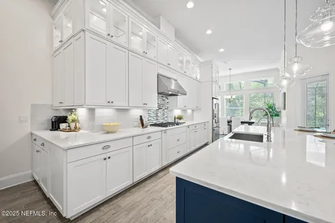 a bathroom with a sink double vanity and a mirror