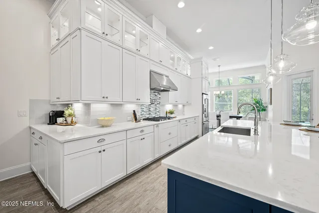 a bathroom with a sink double vanity and a mirror