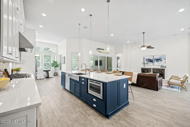 a view of kitchen with furniture and wooden floor