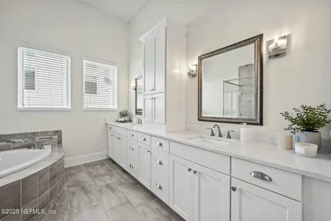 a view of a patio with table and chairs potted plants