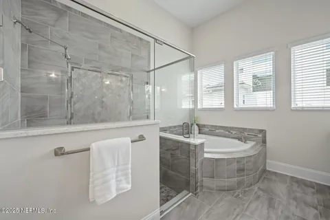 a view of a patio with table and chairs potted plants