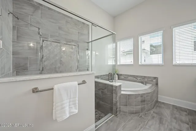a view of a patio with table and chairs potted plants