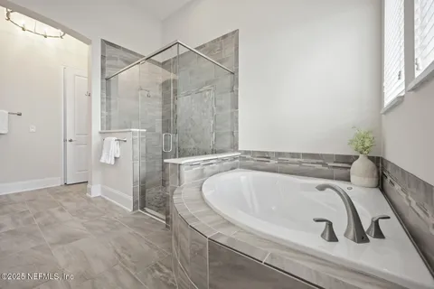 a view of a garden with a bench in a patio