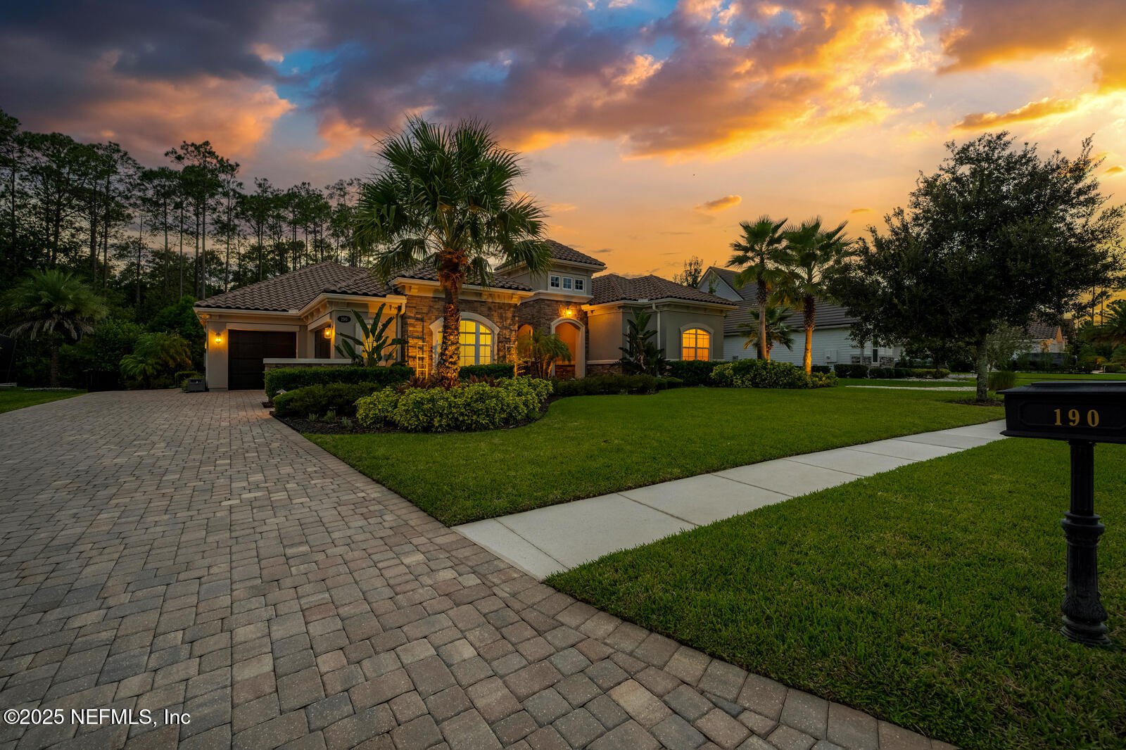 190 Deer Valley Drive Ponte Vedra, FL 32081 - Photo 4 of 95 a front view of a house with a yard and potted plants