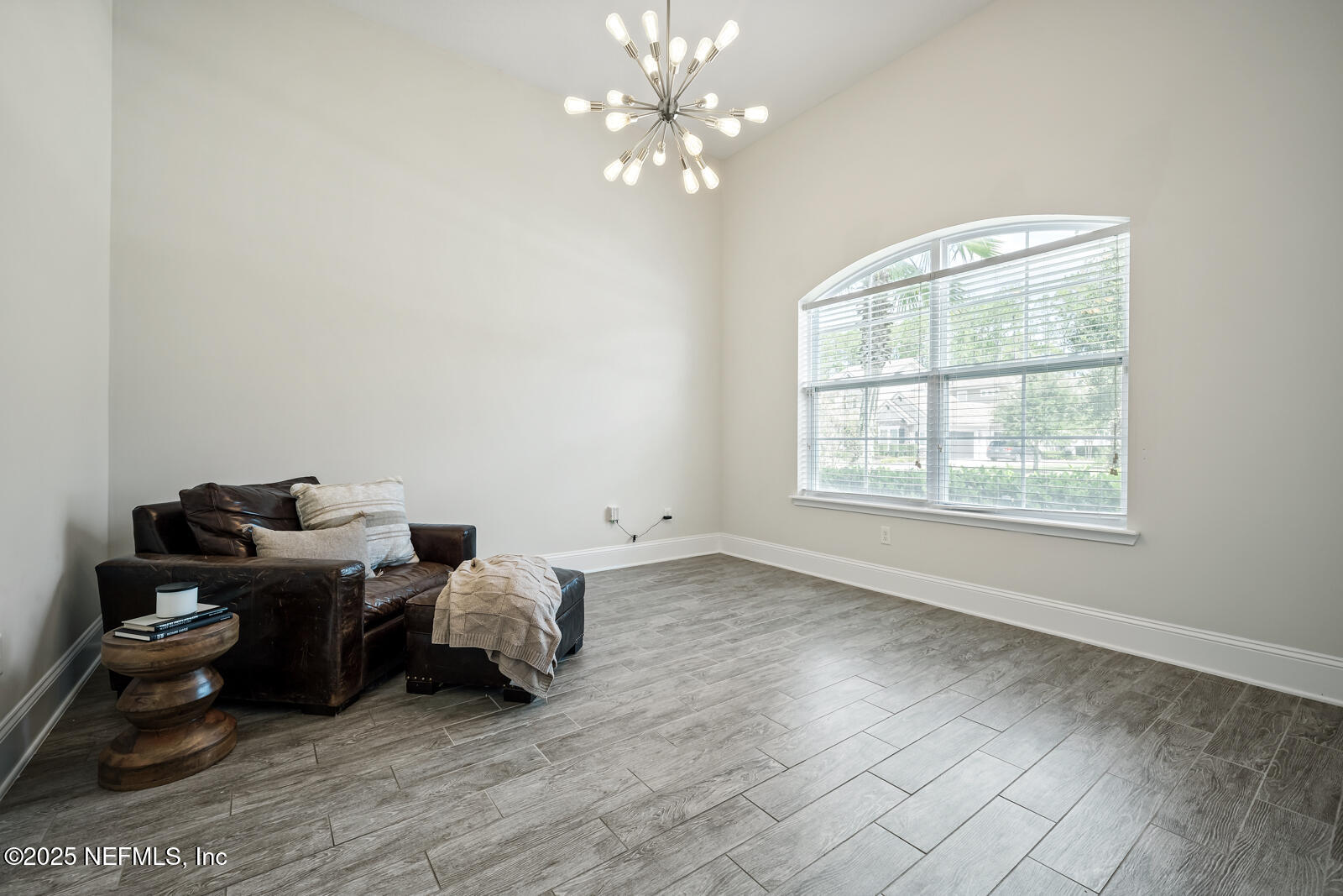 190 Deer Valley Drive Ponte Vedra, FL 32081 - Photo 48 of 95 a living room with furniture and a chandelier