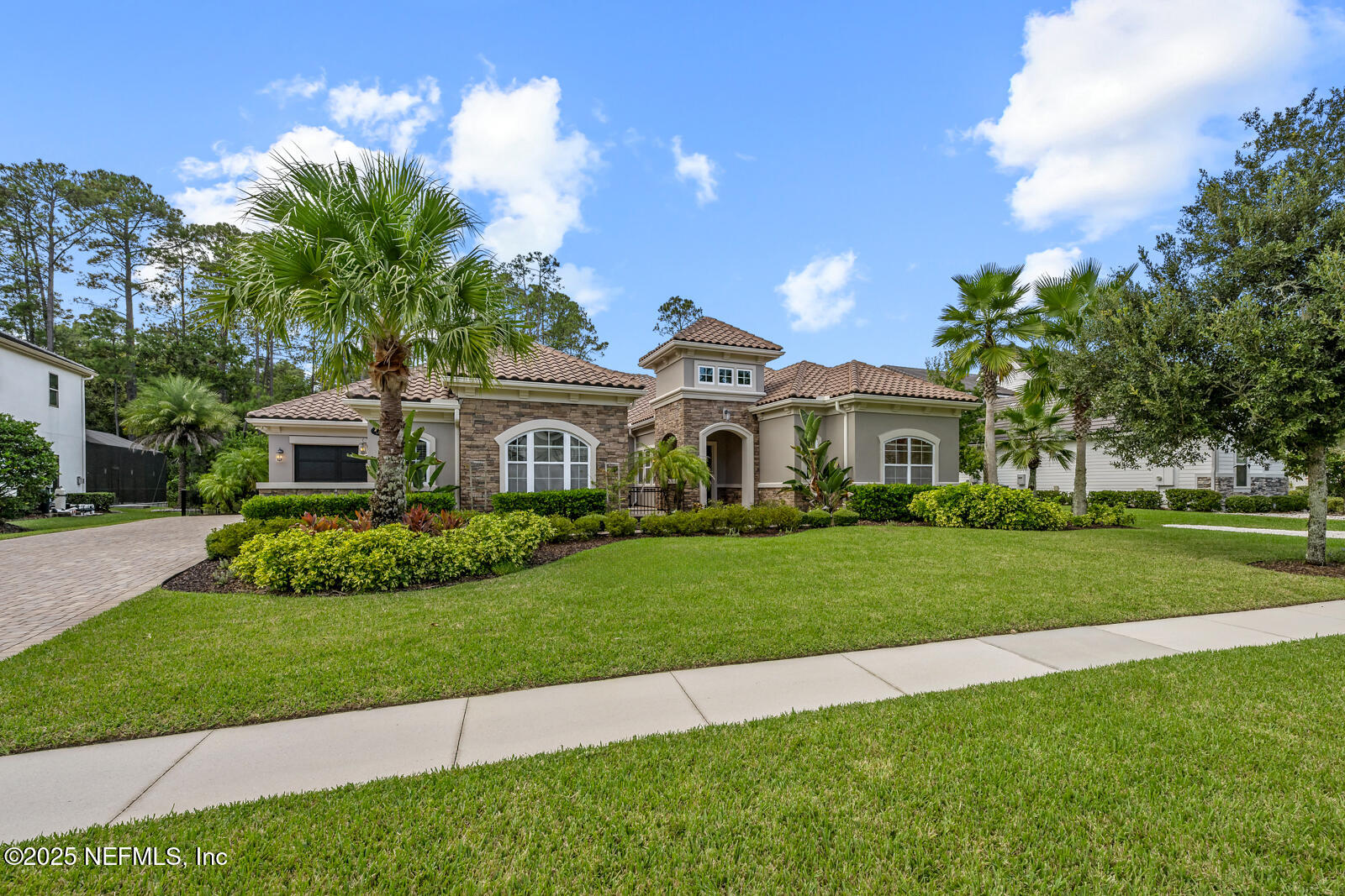 190 Deer Valley Drive Ponte Vedra, FL 32081 - Photo 81 of 95 a front view of a house with a yard and potted plants