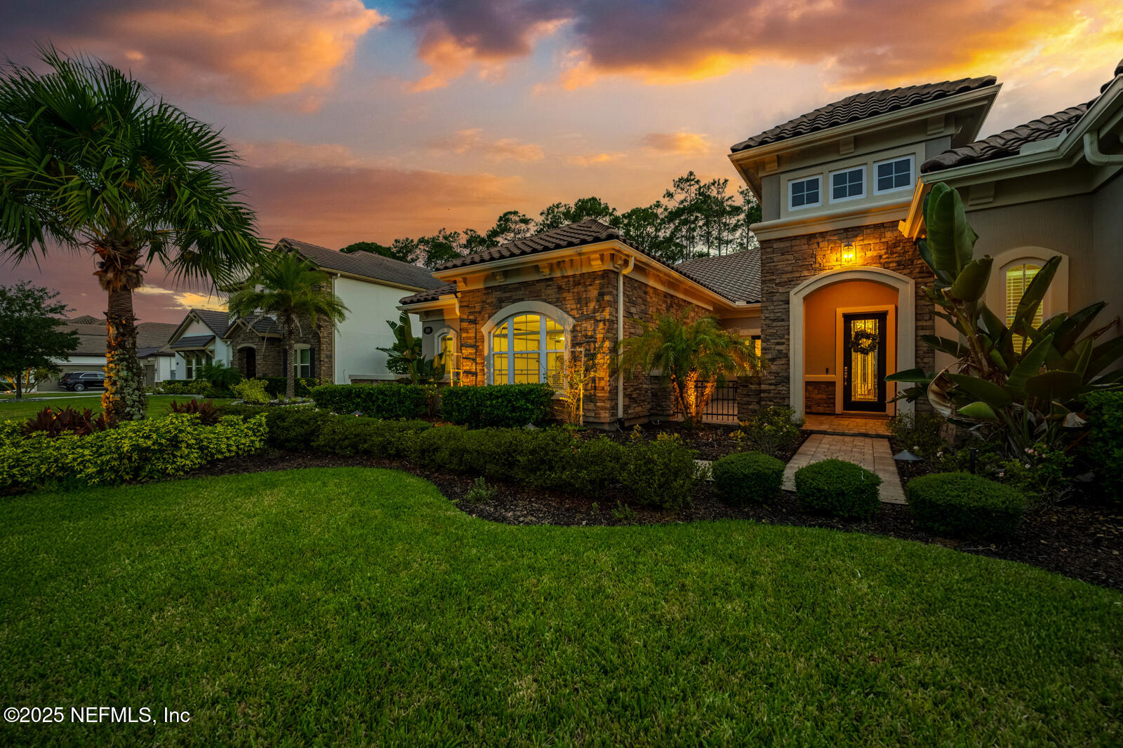 190 Deer Valley Drive Ponte Vedra, FL 32081 - Photo 89 of 95 a front view of a house with a garden