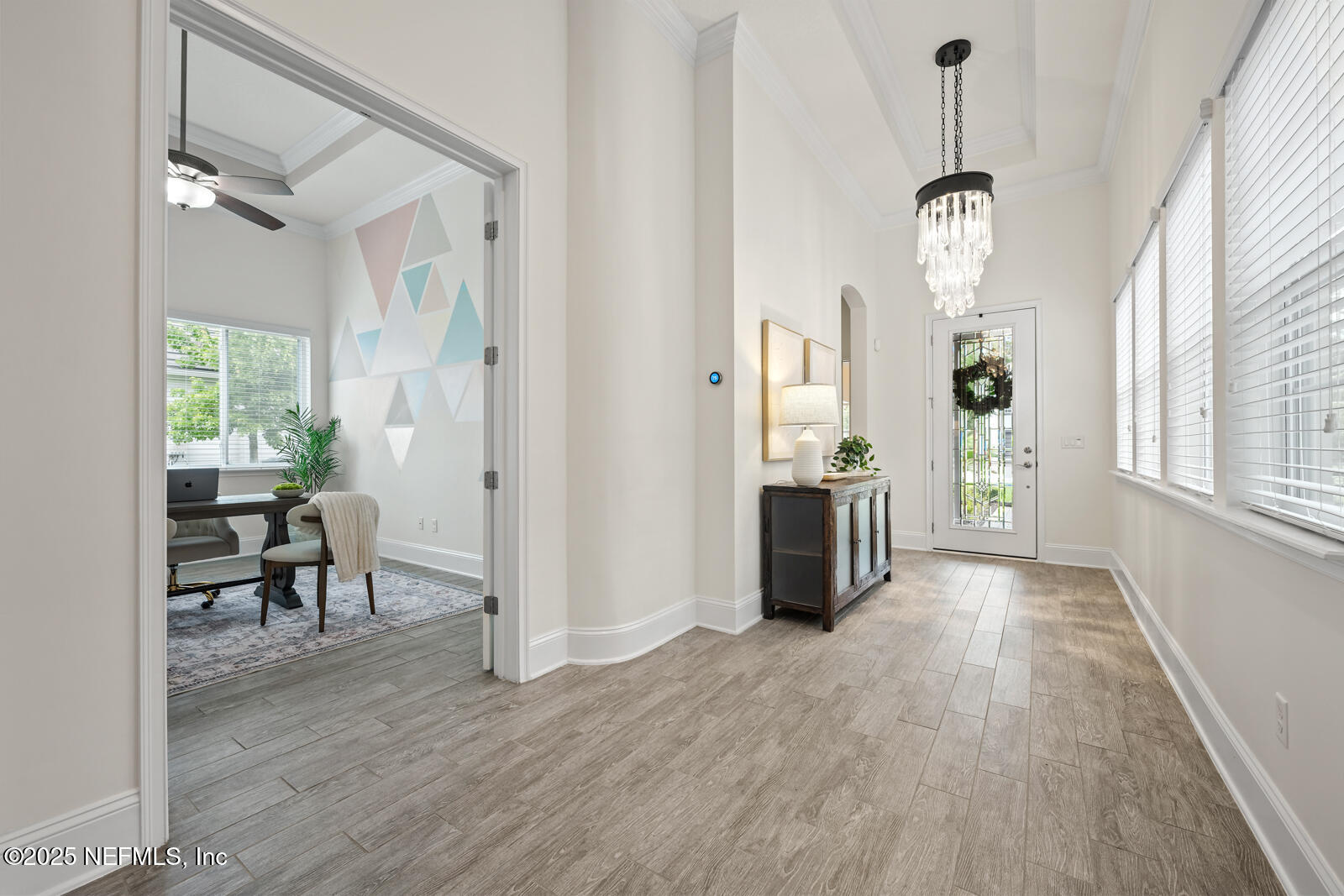 190 Deer Valley Drive Ponte Vedra, FL 32081 - Photo 9 of 95 a view of a dining room and livingroom with furniture wooden floor a chandelier
