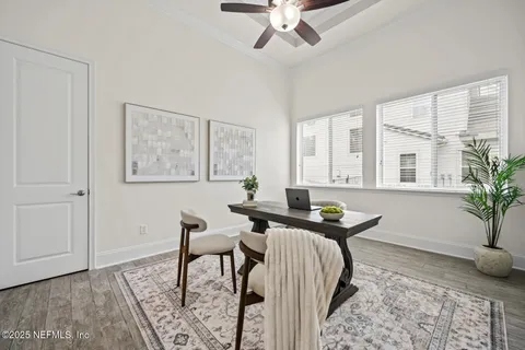 a living room with furniture a rug and a window