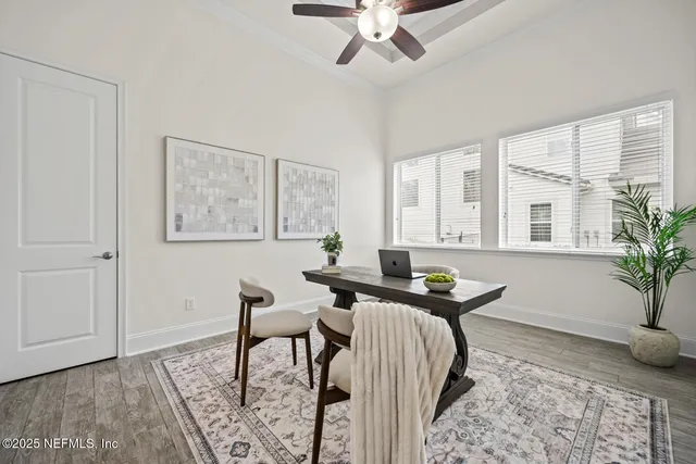 a living room with furniture a rug and a window