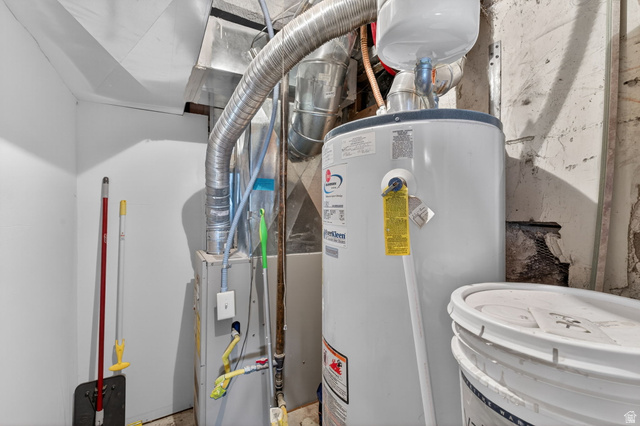 49 South 4th W Street Preston, ID 83263 - Photo 20 of 48 Utility room with water heater and heating unit
