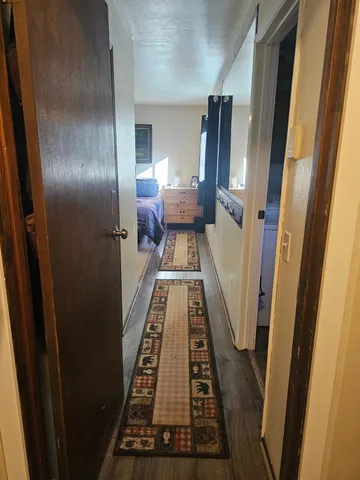 a view of gallery with wooden floor