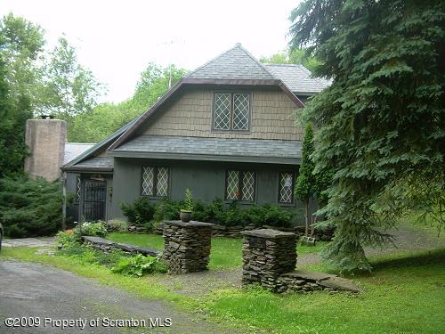 82 Olszewski Road Montrose, PA 18801 - Photo 1 of 4 a front view of a house with garden