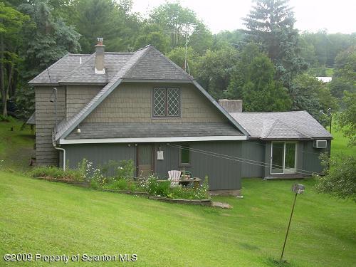 82 Olszewski Road Montrose, PA 18801 - Photo 3 of 4 a front view of a house with garden