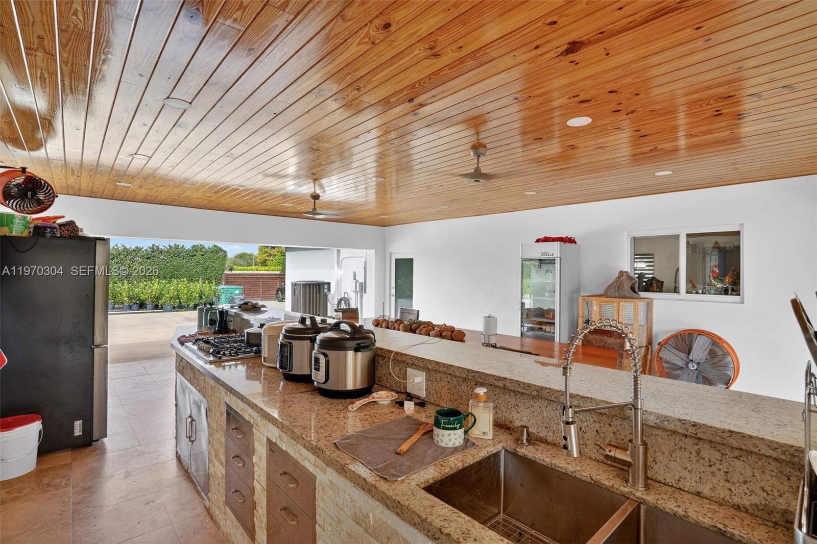 19390 Southwest 312th Street Homestead, FL 33030 - Photo 12 of 41 a kitchen with sink stove and cabinets