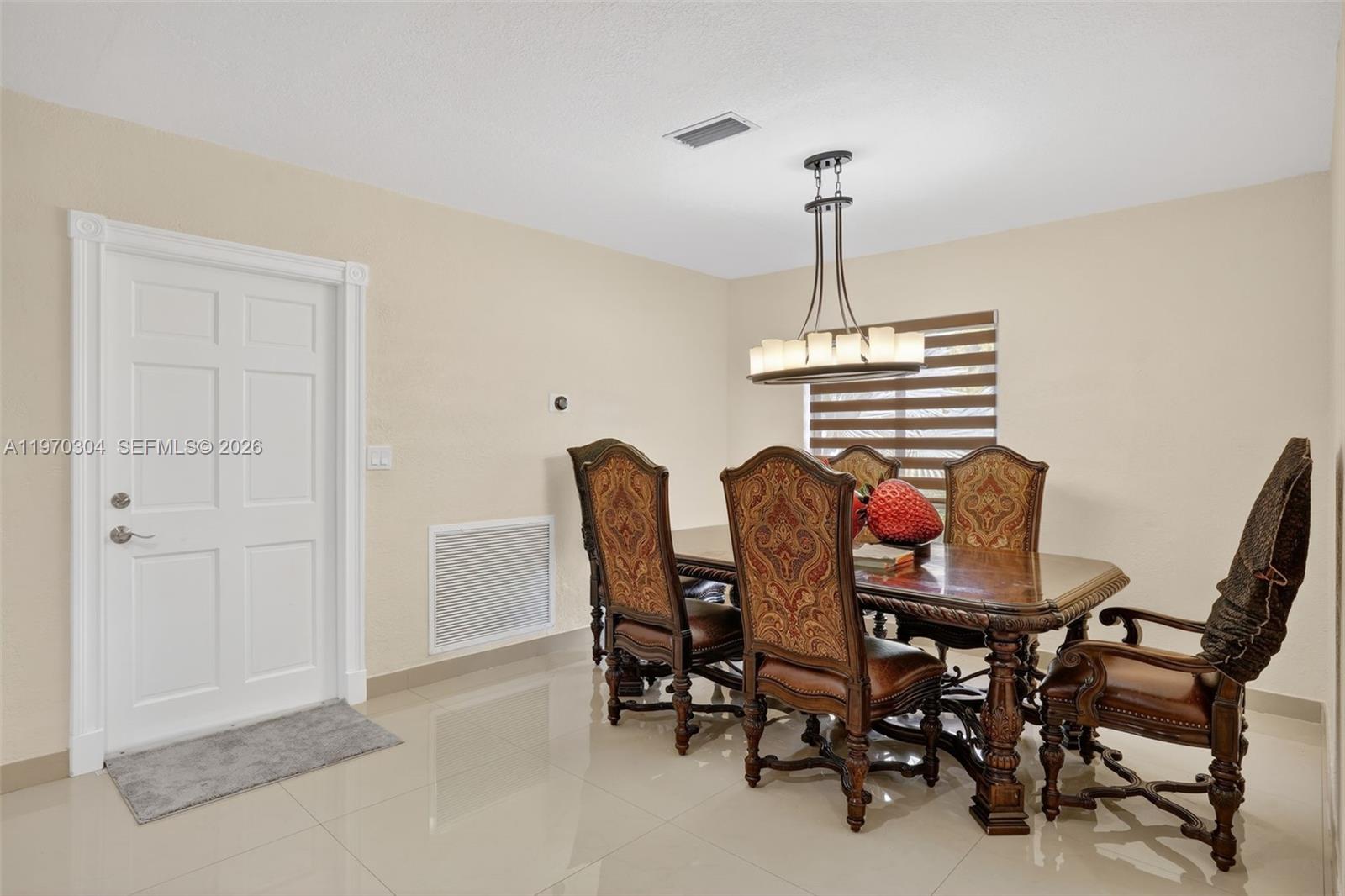 19390 Southwest 312th Street Homestead, FL 33030 - Photo 16 of 41 a dining room with furniture and window