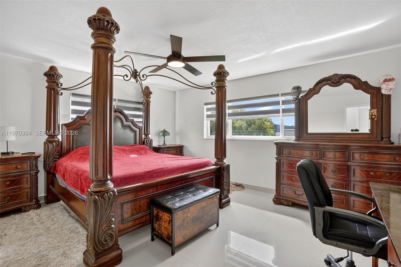 19390 Southwest 312th Street Homestead, FL 33030 - Photo 19 of 41 a bed room with furniture and a window