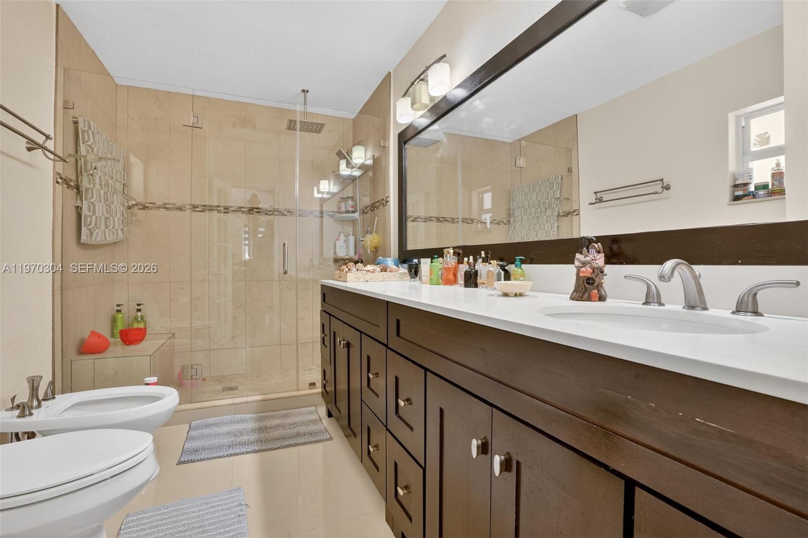 19390 Southwest 312th Street Homestead, FL 33030 - Photo 21 of 41 a bathroom with a sink a toilet and shower