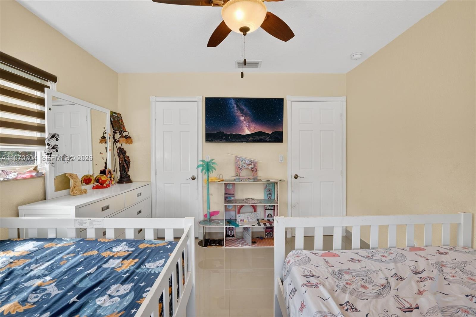 19390 Southwest 312th Street Homestead, FL 33030 - Photo 23 of 41 a living room with furniture and a flat screen tv
