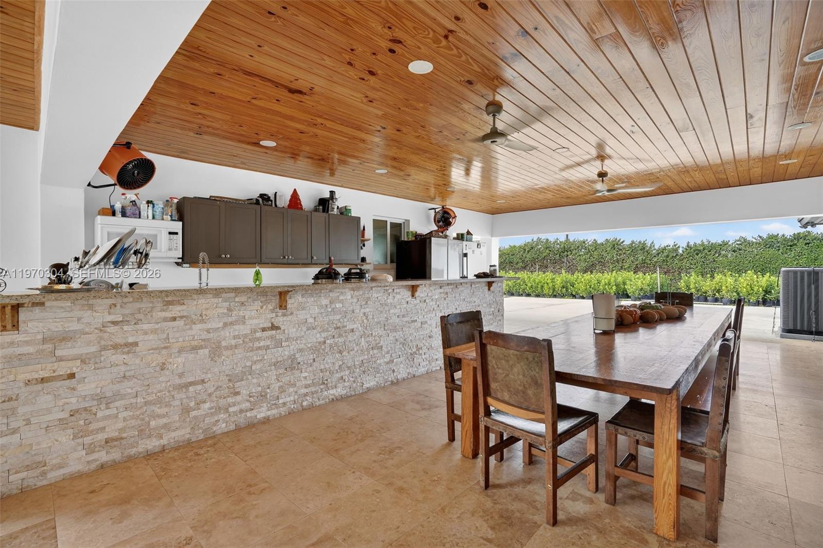 19390 Southwest 312th Street Homestead, FL 33030 - Photo 28 of 41 a outdoor space with lots of furniture and garden view