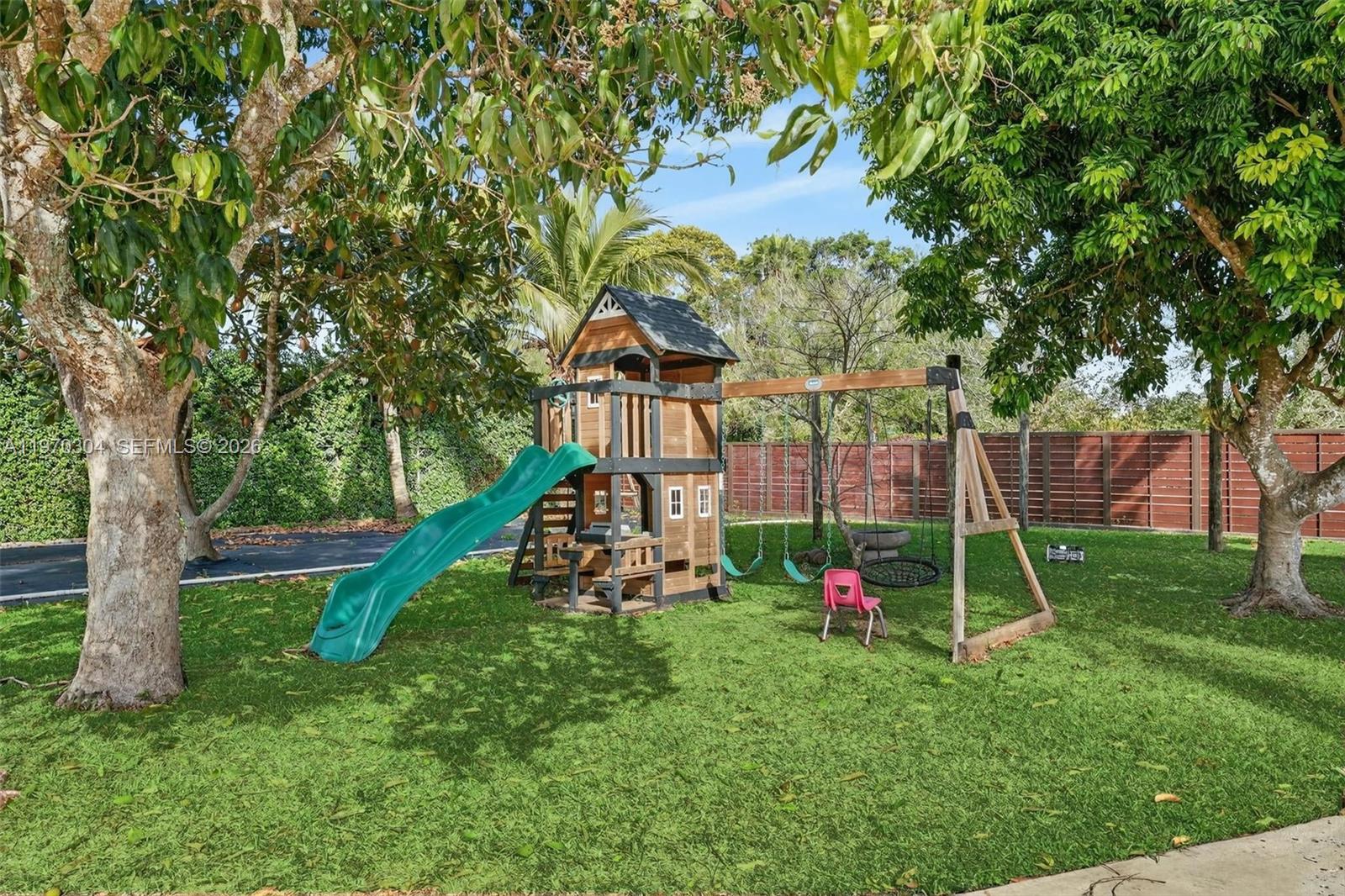 19390 Southwest 312th Street Homestead, FL 33030 - Photo 33 of 41 a view of a park with a slide