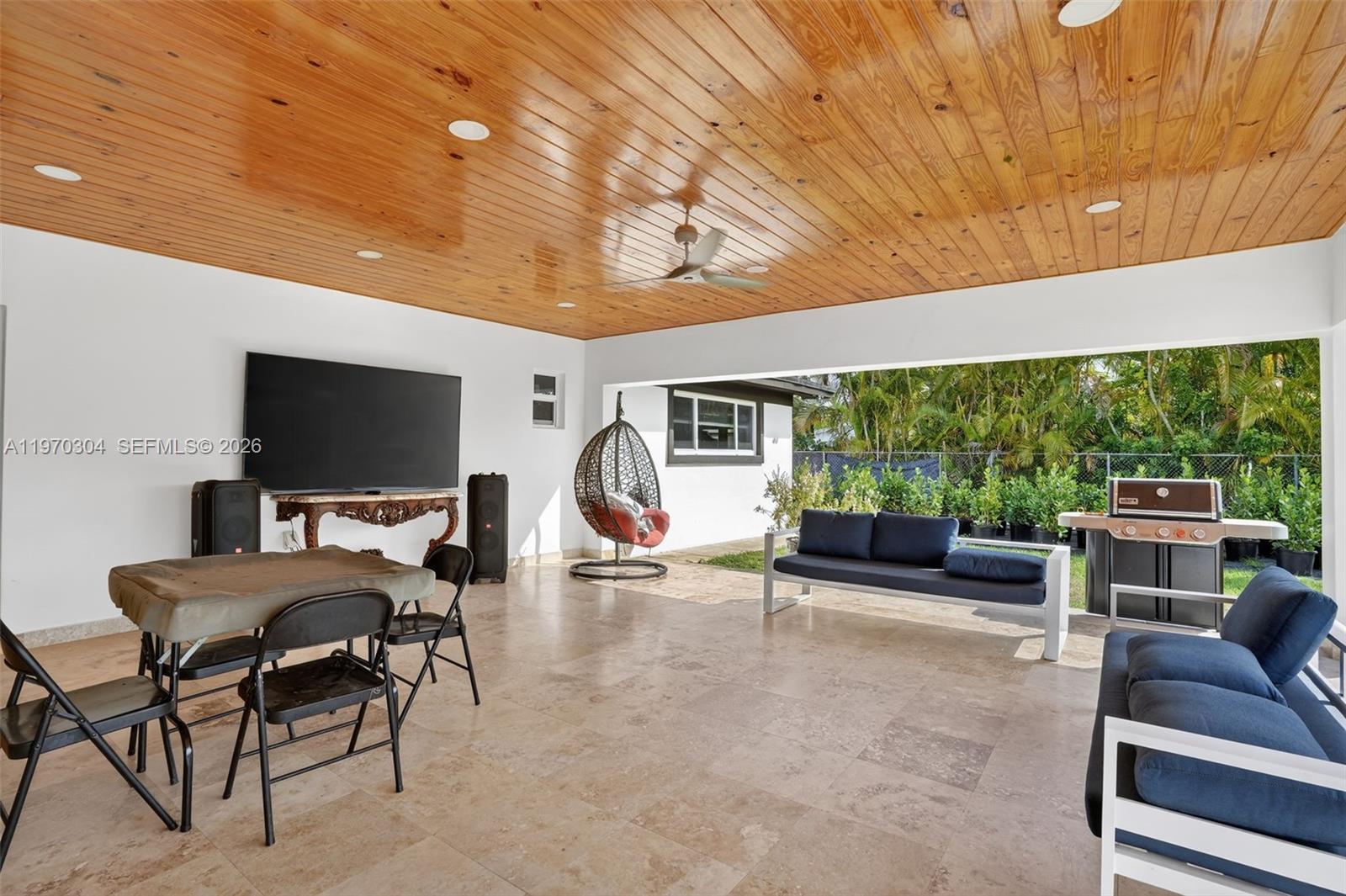 19390 Southwest 312th Street Homestead, FL 33030 - Photo 4 of 41 a view of a livingroom with furniture and a backyard