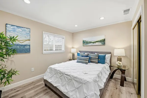 a bathroom with a shower a sink a toilet and shower