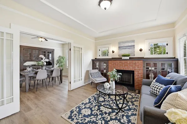 a living room with furniture and a fireplace