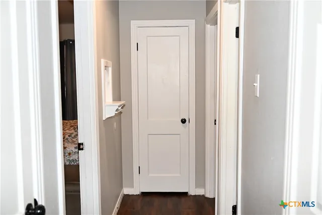a view of a bathroom with wooden floor