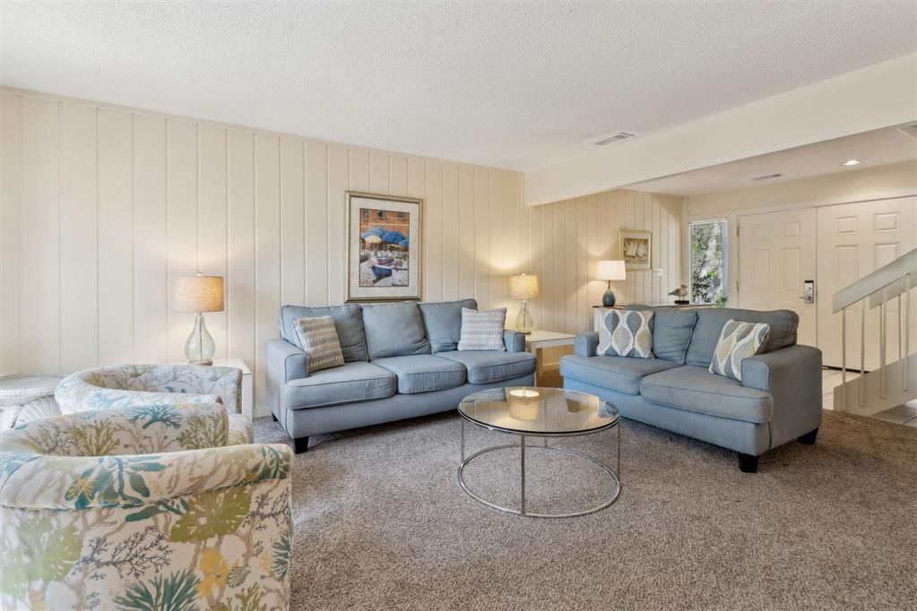 2004 Beachwood Road, Unit 2004 Fernandina Beach, FL 32034 - Photo 6 of 54 a living room with furniture and a potted plant on table