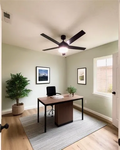 a view of a livingroom with furniture and a potted plant