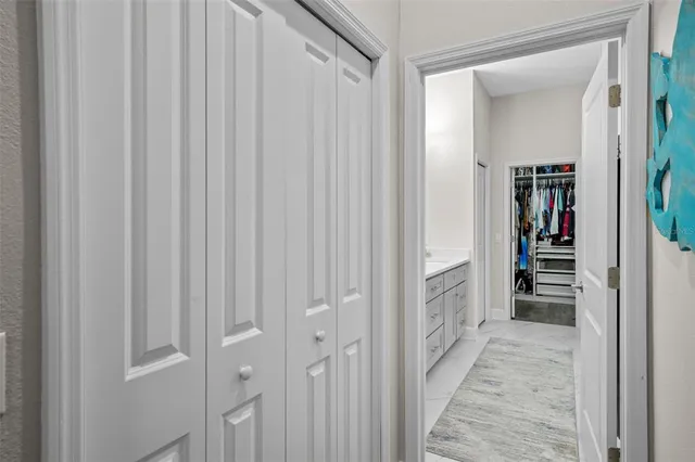 a spacious bathroom with double sink and a mirror
